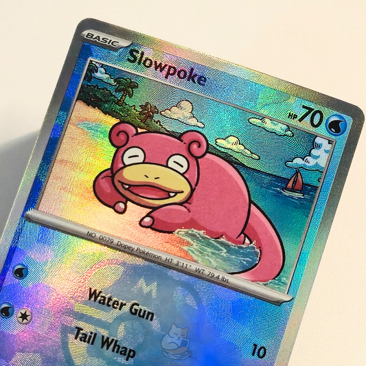 Slowpoke 018/131 Master Ball Holo Rare Pokémon card from Prismatic Evolutions – Near Mint condition – close-up detail
